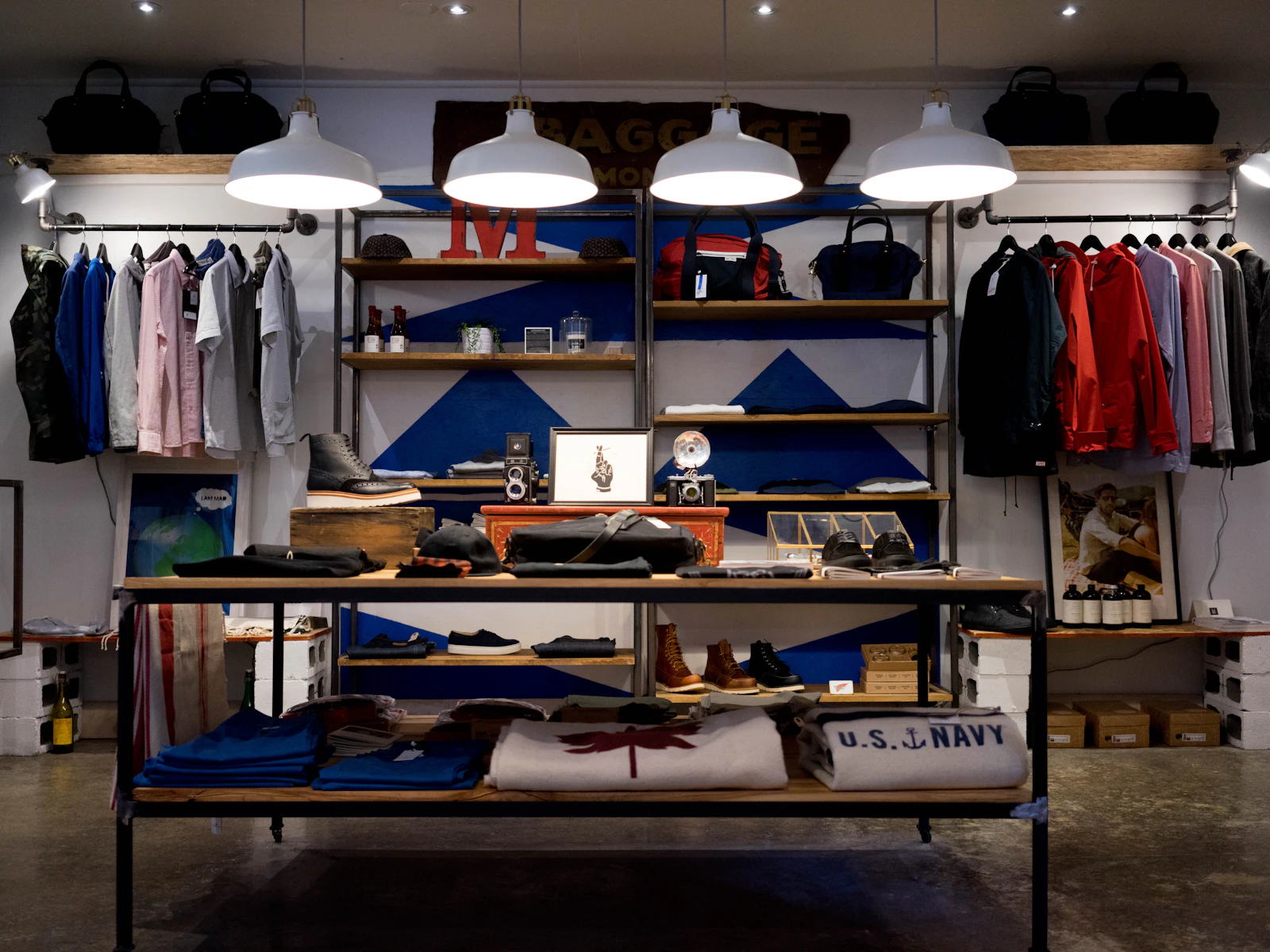 Interior of an independent retail storefront with stocked shelves and racks