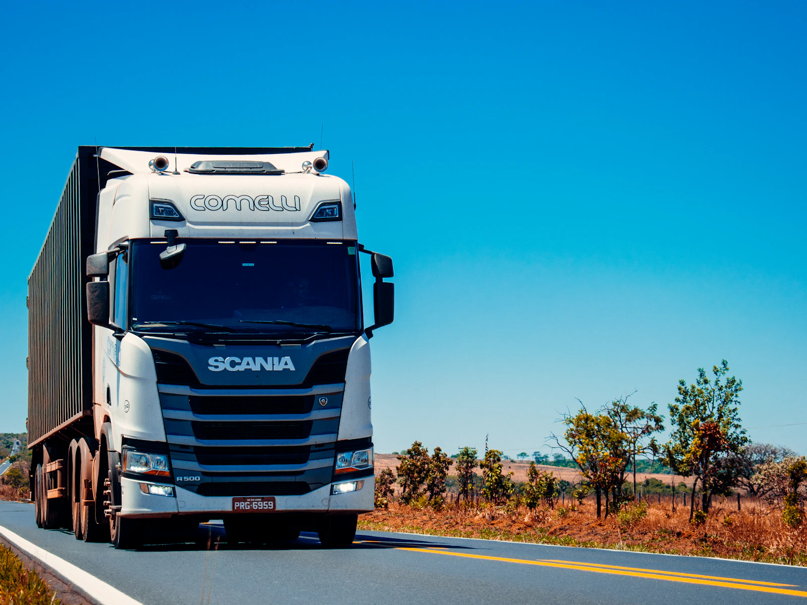 A long-haul freight truck on an open highway